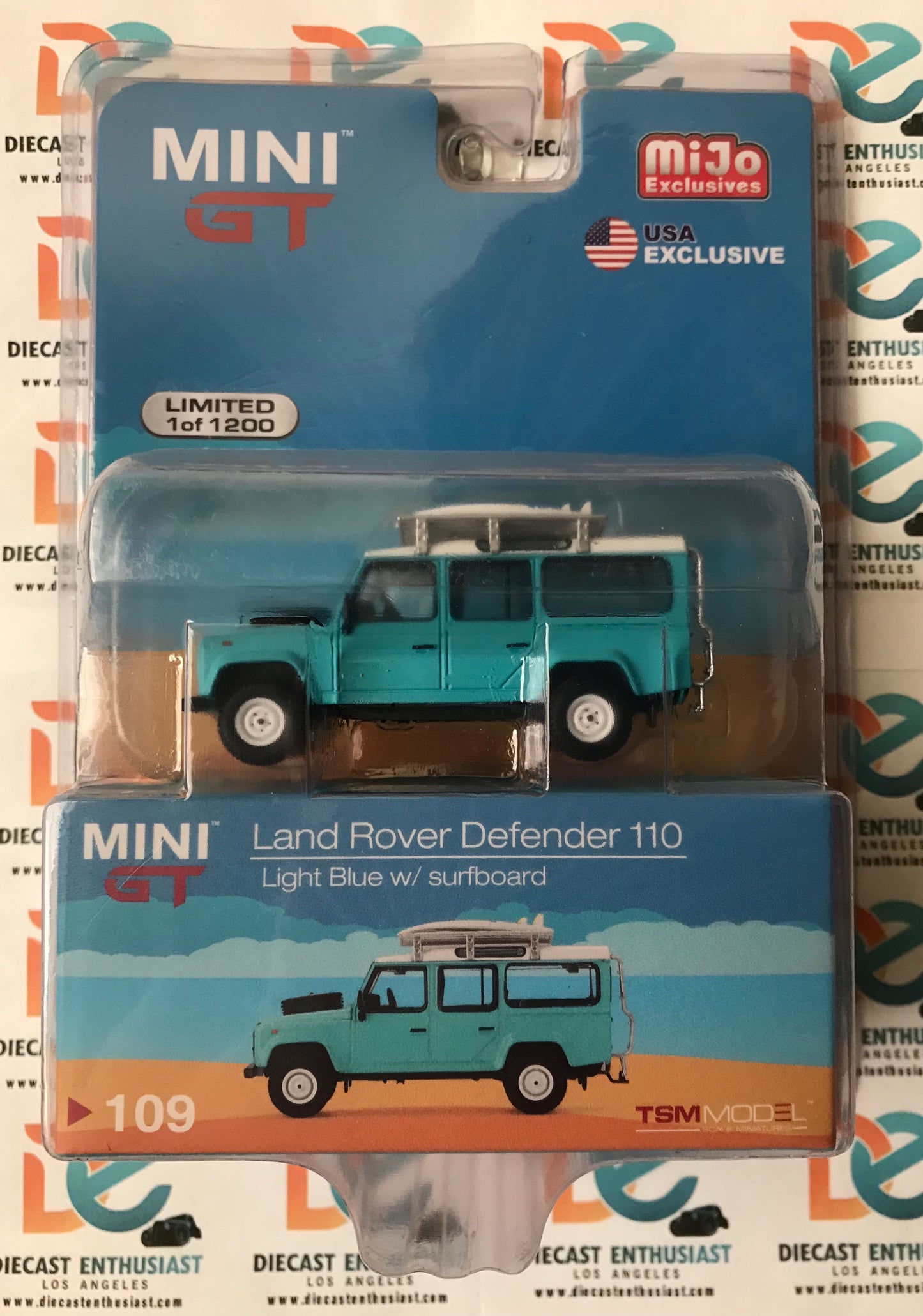 Mini GT Mijo Exclusives 109 Land Rover Defender 110 Light Blue with Surfboard 1:64