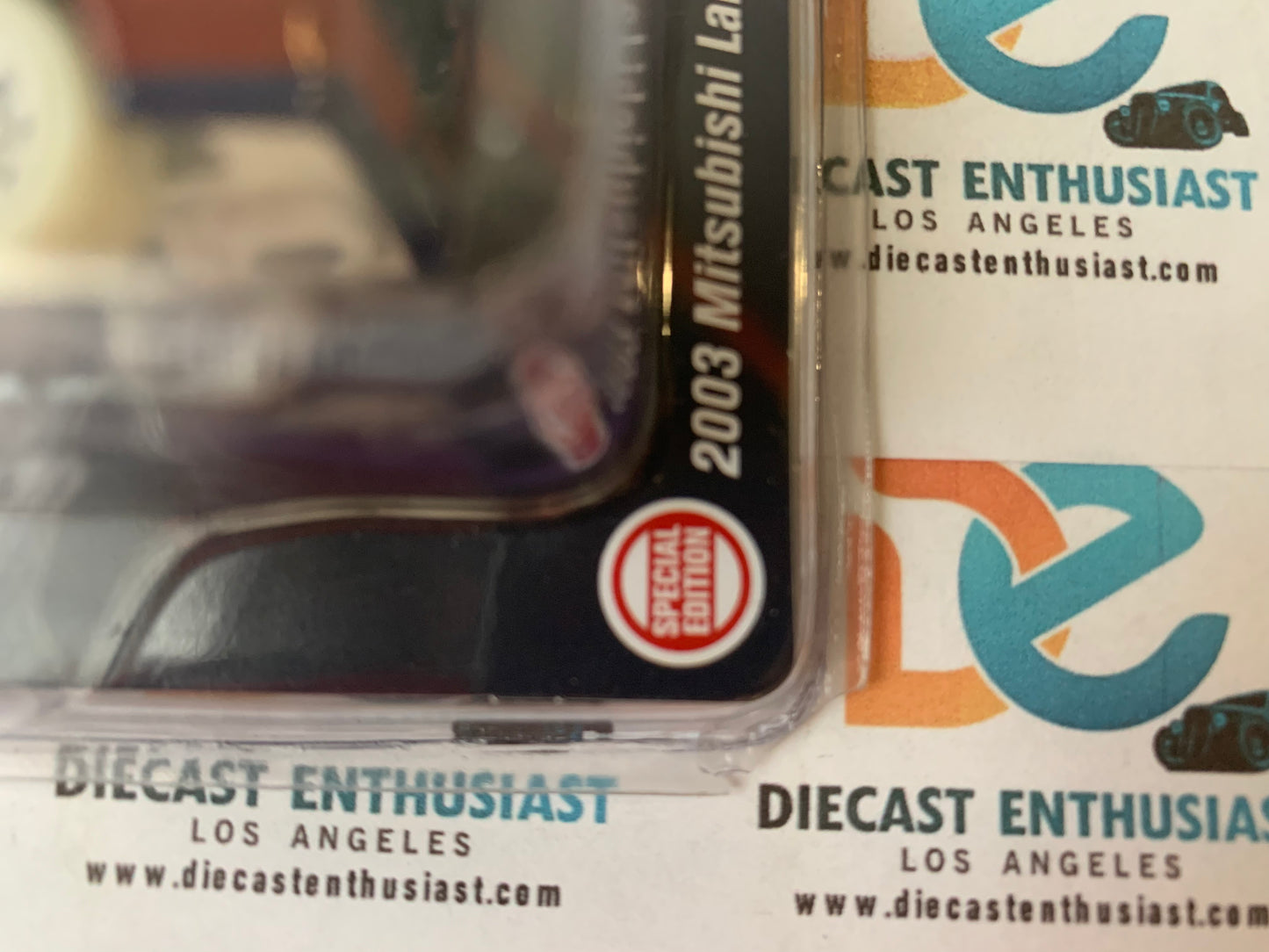 DAMAGE CHASE Johnny Lightning Bishop Exclusives Intersport 2003 Mitsubishi Lancer Evolution Blue 1:64