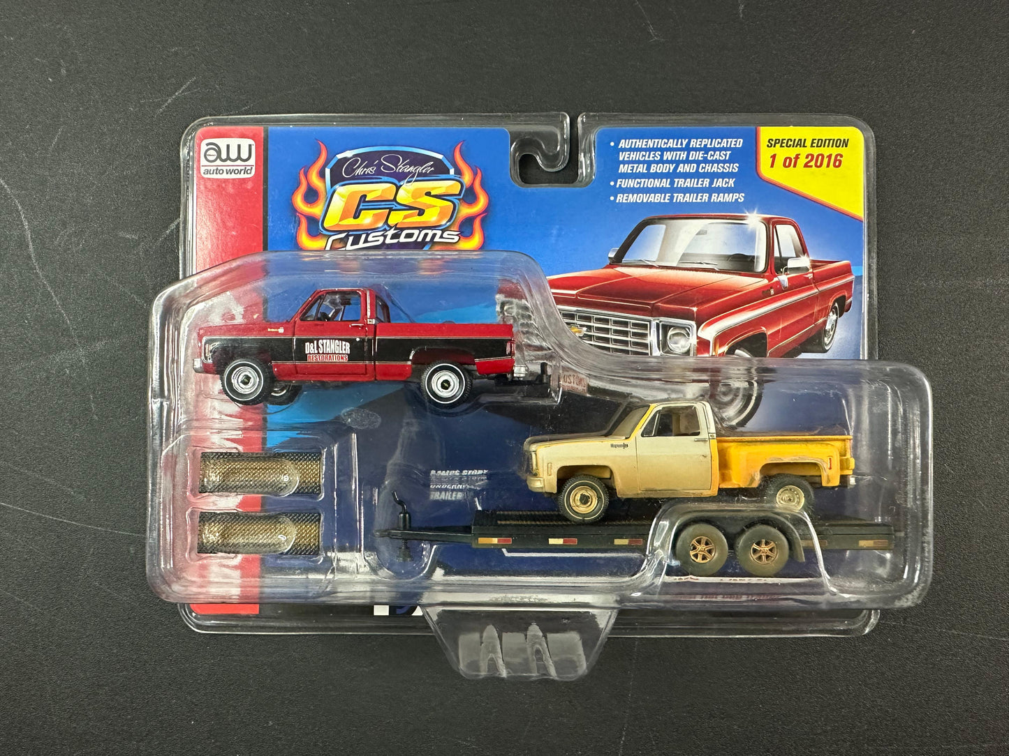 Auto World Chris Stangler CS Customs 1975 & 1974 Chevy Pickup with flatbed Trailer 1:64