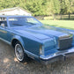 Auto World 1977 Lincoln Continental Coupe Mark V Med Blue Diamond Bright 1:64