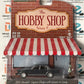 Greenlight The Hobby Shop 1981 Chevrolet Caprice Classic Silver with Woman Figure 1:64